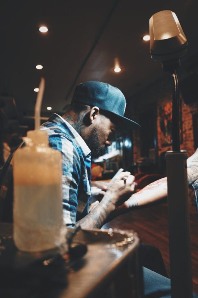 9 Black Tattoo Artists Who Bring Art To Brown Skin  –