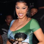 Cardi B Sells Copies Of "Am I The Drama?" On The Streets Of Manhattan In Comedic Clip