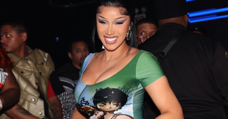 Cardi B Sells Copies Of "Am I The Drama?" On The Streets Of Manhattan In Comedic Clip