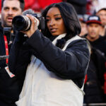 Simone Biles Served As An Official NFL Photographer During Bears-49ers Game