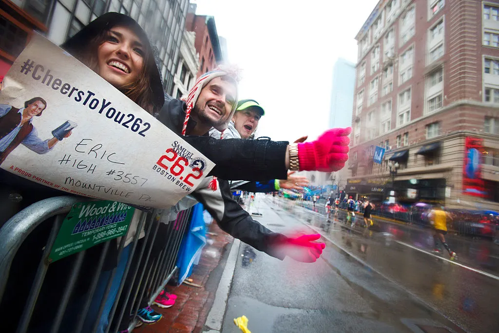 Too Busy Gloating: Runner Celebrates Too Early, Gets Beaten, But the Reaction of the Woman Holding the Finish Banner Goes Viral