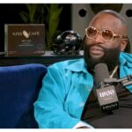 Rick Ross Responds After Viral Airport Photo Shows Him Flying Commercial | VIDEO