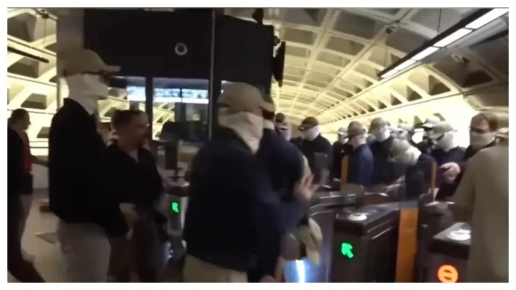 ‘Pure Evil’: Viral Photo of Black Woman Surrounded by Masked White Men on Train Stuns Internet, Revives Memories of KKK Terror ‘Pure Evil’: Viral Photo of Black Woman Surrounded by Masked White Men on Train Stuns Internet, Revives Memories of KKK Terror